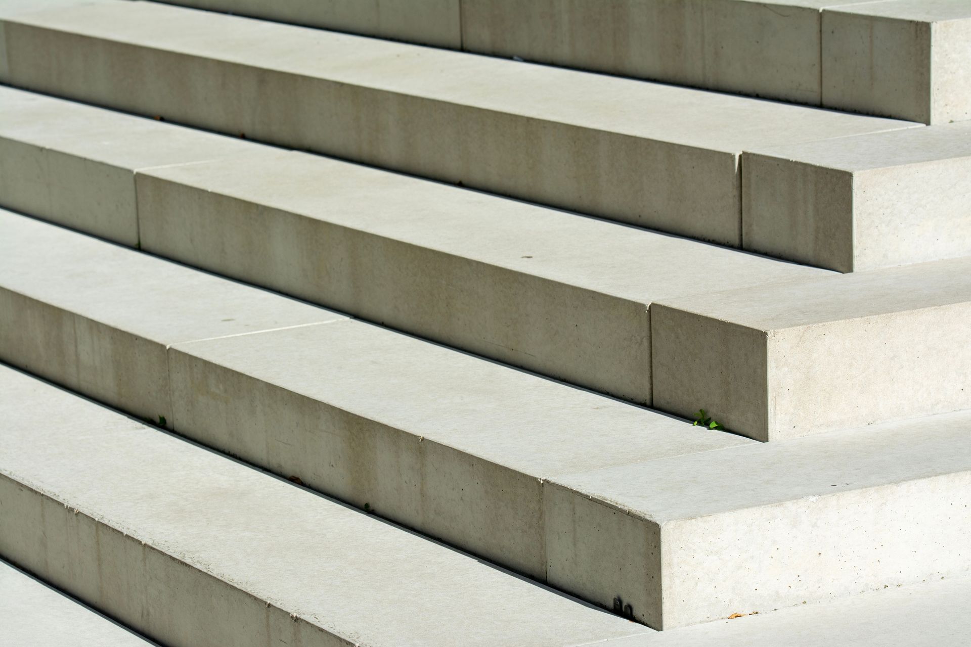 Close-up of modern concrete stairs showing geometric patterns and urban aesthetics.